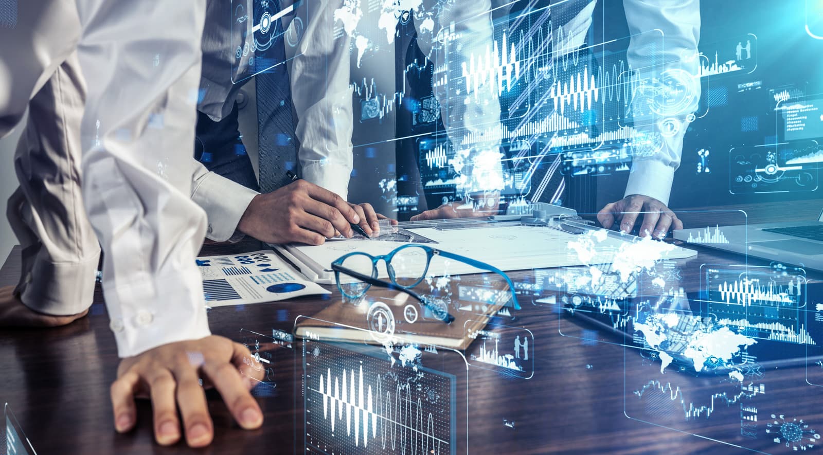 Professionals collaborating with global data visualisations